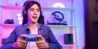 A young person gaming at home